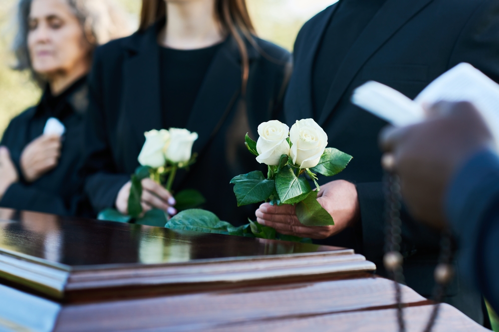 A family discussing funeral pre-planning options to ensure final wishes are honored and financial burdens are reduced.