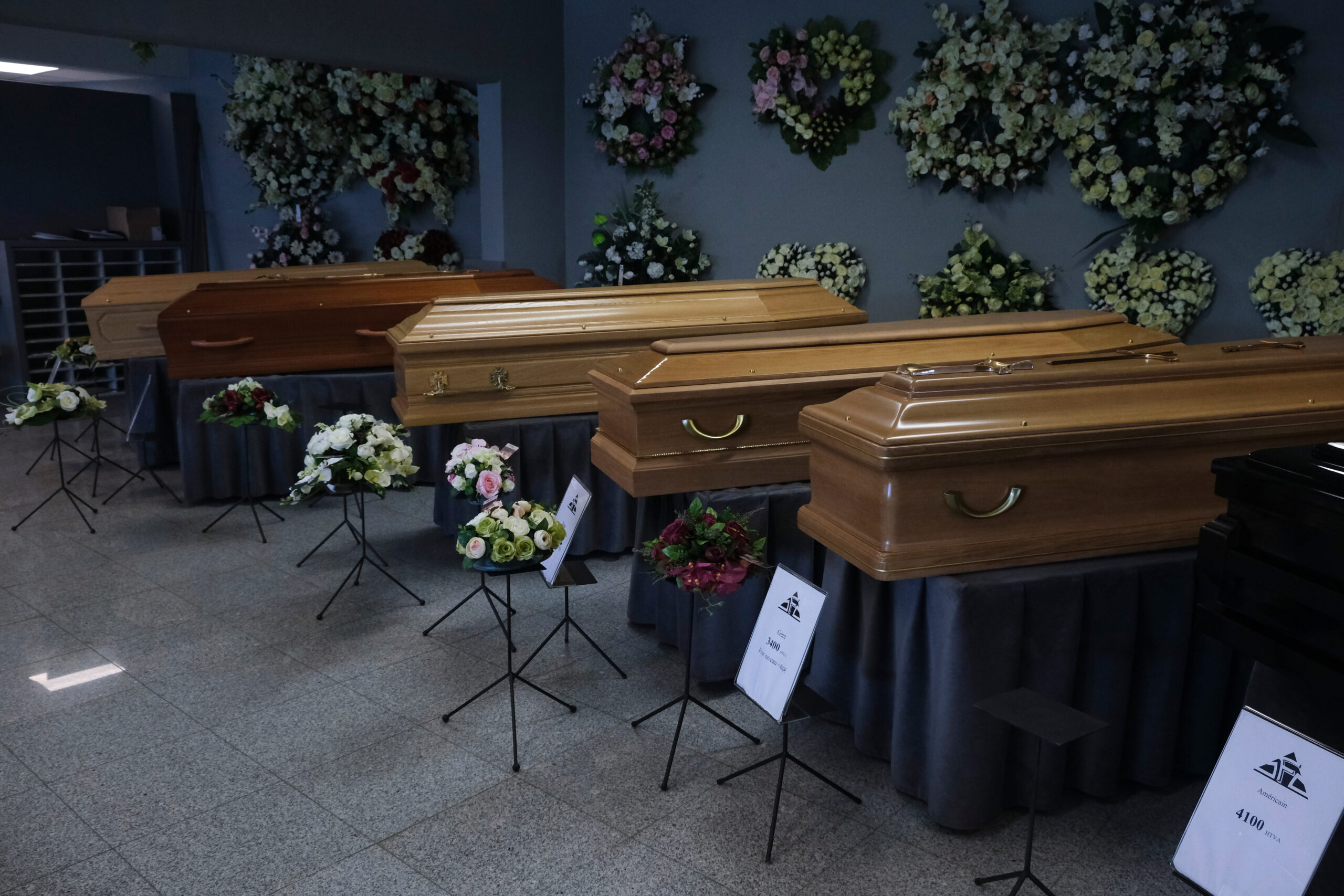 Breakdown of funeral home pricing, including burial, cremation, and service costs.