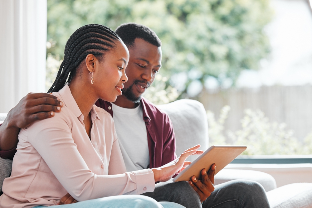A family sitting together in a warm setting, discussing funeral pre-planning with compassion and understanding.