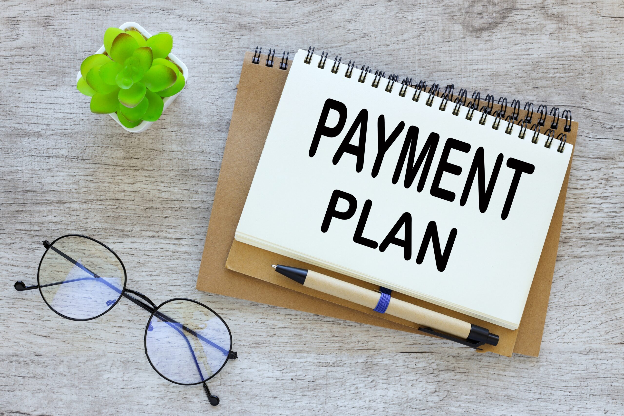 Funeral Payment Plans – Options to Ease Funeral Costs A grieving family discussing funeral payment plans with a funeral director.