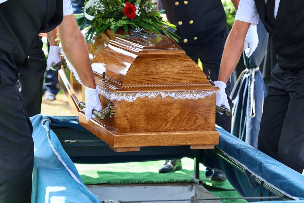 Funeral director meeting with a family to review service costs and options.